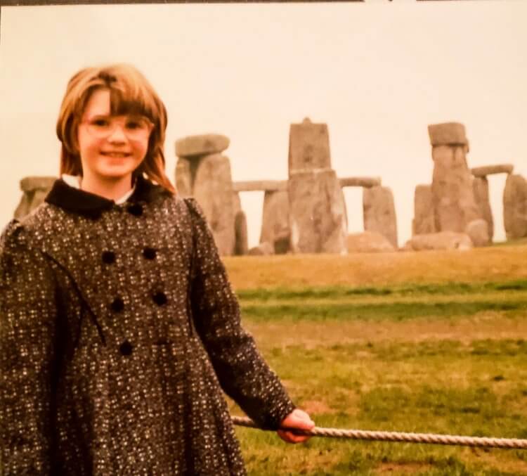 Vintage photo of a little girl in front of Stonehenge