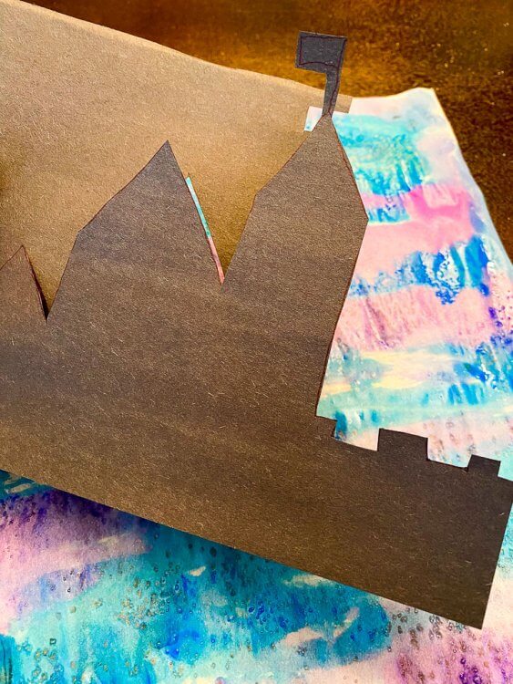Silhouette of a castle on black paper.