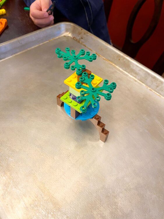 A lego creation sitting on the cookie tray.