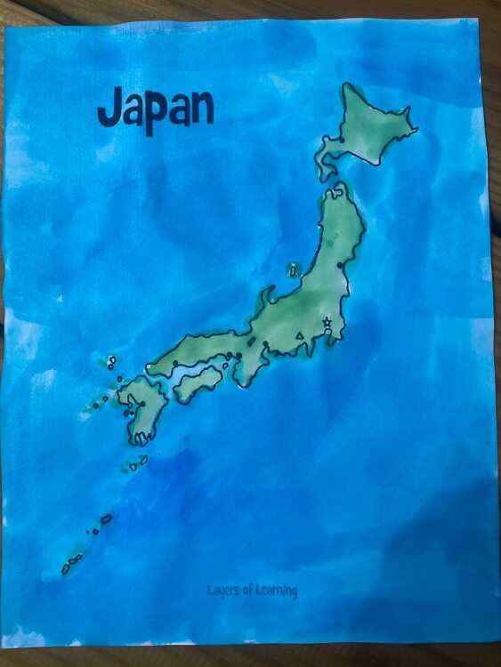Finished map of Japan with a green color on the country and a blue background.